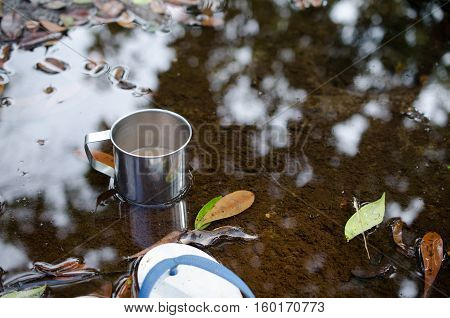 Place in a glass of hot coffee and cold clear streams. White sandals relaxing waterfront.