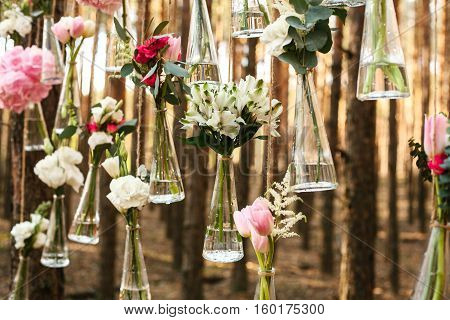 Wedding flowers decoration arch in the forest. The idea of a wedding flower decoration. wedding concept in nature.