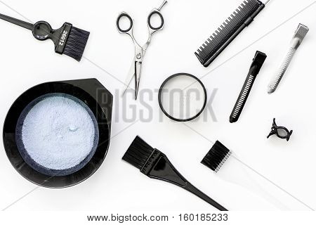 Tools for hair dye and hairdye top view on white background