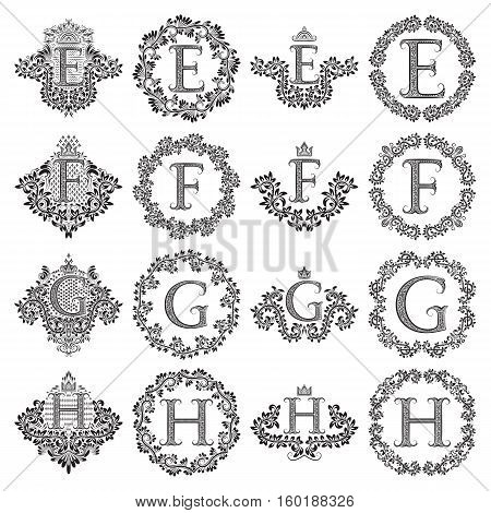 Vintage monograms set of letters E F G H. Heraldic coats of arms symbols in floral round frames.