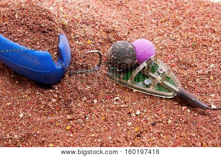 Dry Feed For Carp Fishing As Background. Ready For Use Carp Bait With Fishing Flat Feeder For Carp F