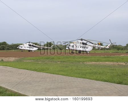 BOR, SOUTH SUDAN-JUNE 26, 2012: UN peacekeeping helicopters sit on the runway in Bor, South Sudan