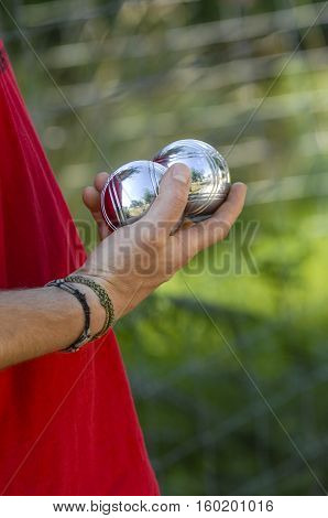Hand Of Man Holding Petanque Ball Or Boule