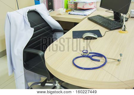stetchoscope on desk doctor and computor selective focus of stetchoscope