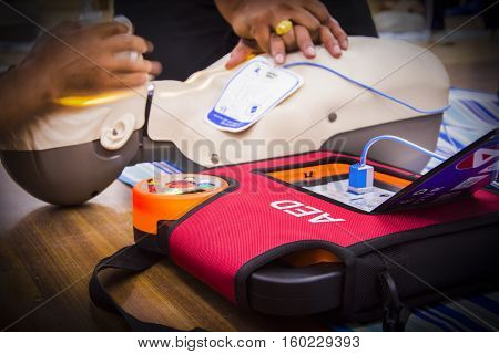 cpr with aed training select focus AED text and blur background