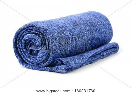 Blue rolled blanket isolated on white