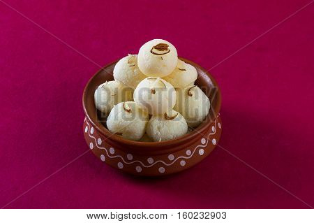 Indian Sweet or Dessert - Rasgulla, Famous Bengali sweet in clay bowl