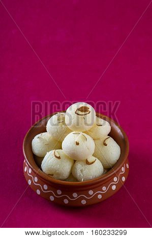 Indian Sweet or Dessert - Rasgulla, Famous Bengali sweet in clay bowl