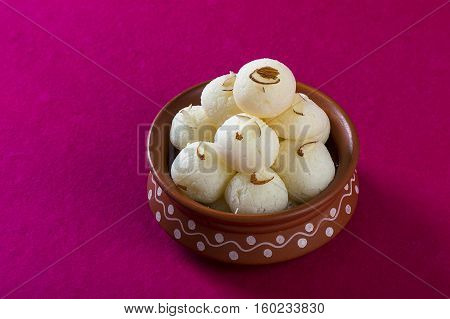Indian Sweet or Dessert - Rasgulla, Famous Bengali sweet in clay bowl