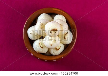 Indian Sweet or Dessert - Rasgulla, Famous Bengali sweet in clay bowl