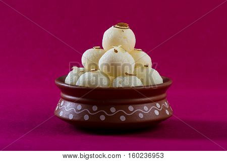 Indian Sweet or Dessert - Rasgulla, Famous Bengali sweet in clay bowl