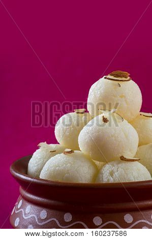 Indian Sweet or Dessert - Rasgulla, Famous Bengali sweet in clay bowl