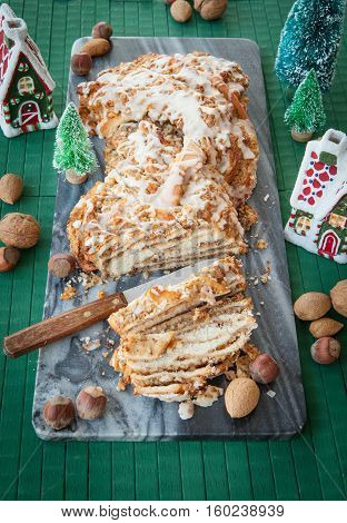 Homemade braided nutcake with quaint christmas decorations