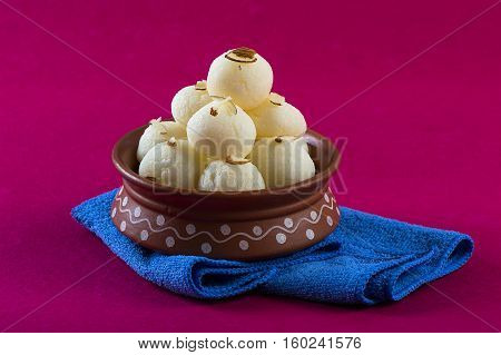 Indian Sweet or Dessert - Rasgulla, Famous Bengali sweet in clay bowl with napkin
