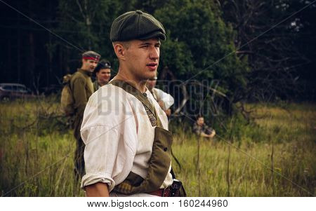 POKROVSKOE SVERDLOVSK OBLAST RUSSIA - JULY 17 2016: Historical reenactment of Russian Civil war in the Urals in 1919. Soldier of the militia
