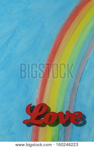 The word love with a background rainbow illustrating the concept of love lust desire and joy; portrait format