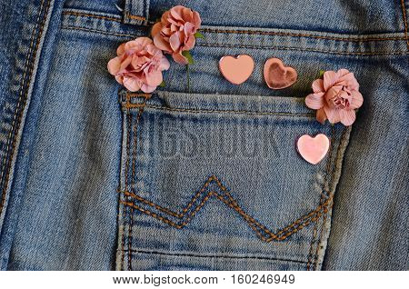 on jeans background laid roses and hearts. Backgrounds Valentine's Day. Wedding background. love card. pocket jeans