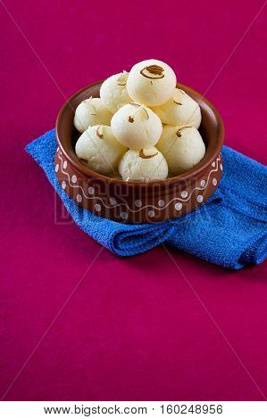 Indian Sweet or Dessert - Rasgulla, Famous Bengali sweet in clay bowl with napkin