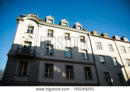 old houses in munich - schwabing, blue sky