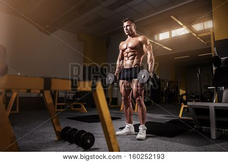 Muscular Bodybuilder Guy Doing Exercises With Dumbbell