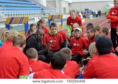 ZHUKOVSKY, MOSCOW REGION, RUSSIA - JUNE 27, 2014: IAAF World Champion Wilson Kipketer of Denmark gives a master class for young Russian athletes during the Znamensky Memorial