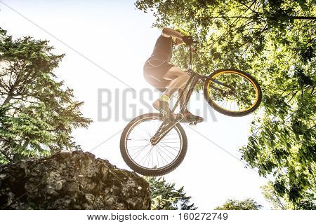 Young athlete making tricks on his bicycle