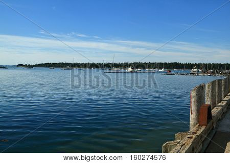 East Marina of Saint Andrews town in Charlotte County New Brunswick situated in Fundy Bay (with highest tides) of Atlantic Ocean. On background is seen Navy Island