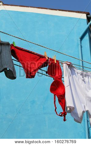 Big red bra and panties hung out to dry in the sun