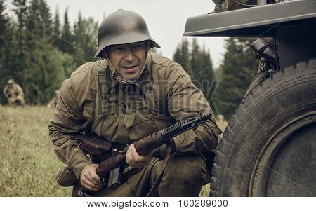 PERM RUSSIA - JULY 30 2016: Historical reenactment of World War II summer 1942. Soviet soldier with rifle