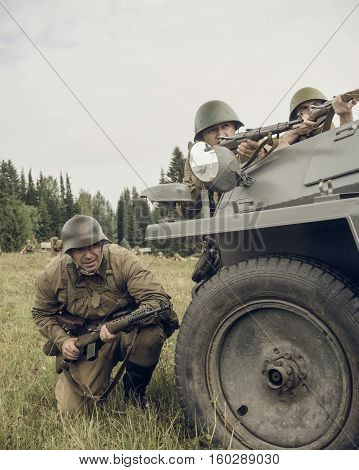 PERM RUSSIA - JULY 30 2016: Historical reenactment of World War II summer 1942. Soviet soldiers with rifles