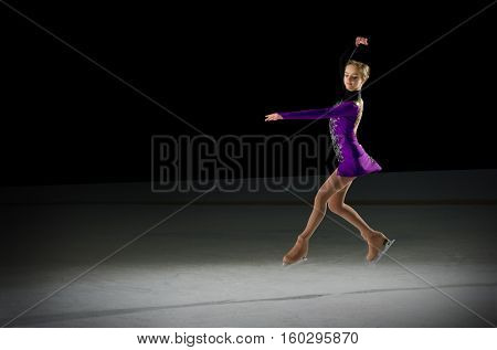 Young girl figure skater (on ice arena ver)