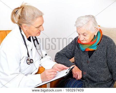 Picture of an elderly woman with her caregiver
