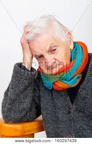 Picture of an ill elderly woman beling lonely