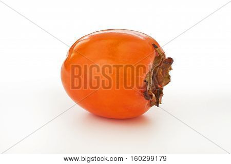 Single Japanese persimmon (Diospyros kaki) isolated on white background