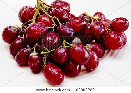 Red grapes with water drops .Beautiful color fruitใ