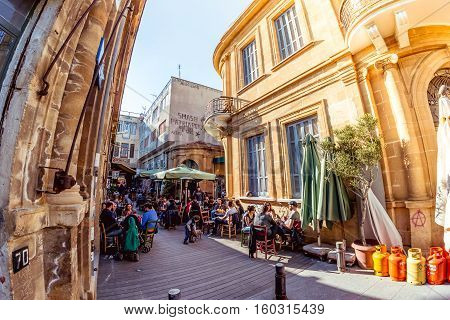NICOSIA - APRIL 13 2015: People at restaurants and traditional coffee shops on Ledra street