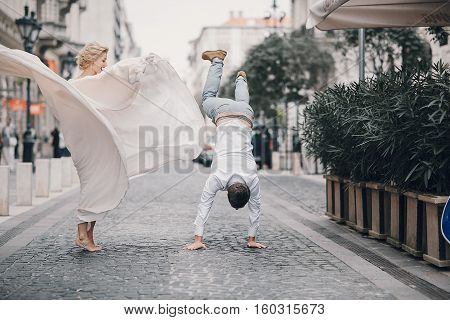 beautiful unique couple walks into your wedding day in Budapest