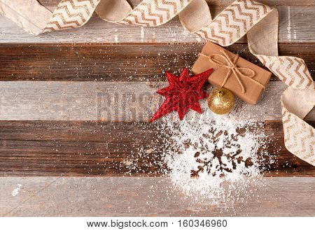 Christmas decoration with gift box and decoration on wooden background