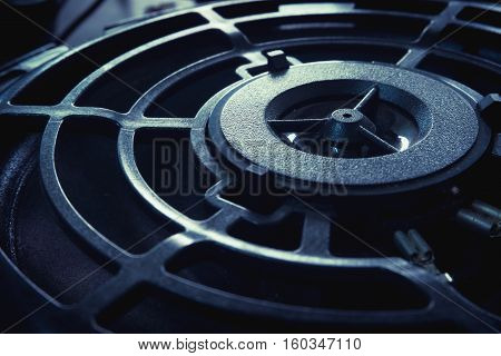 Part of old car audio speaker with selective focus and vintage filtered effect