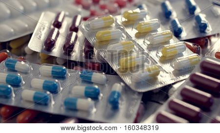 A lot of different colored capsules per pack