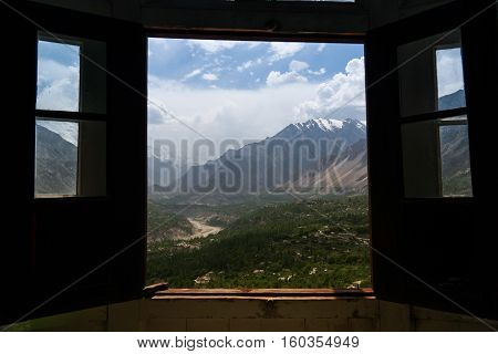View to Karimabad and Hunza valley through the Baltit fort window Pakistan