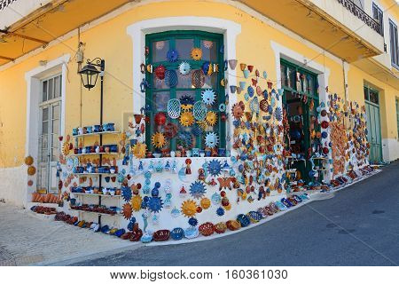 MARGARITES, CRETE - SEPTEMBER 15, 2016 - Pottery displayed on the wall of a shop in the village centre Margarites Crete Greece Europe, September 15, 2016.