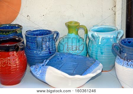 Cretan pottery displayed outside a shop in the village centre Margarites Crete Greece Europe.