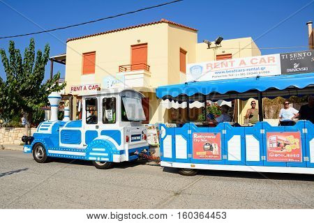 PANORMOS, CRETE - SEPTEMBER 15, 2016 - View the towns blue tourist land train Panormos Crete Greece Europe, September 15, 2016.