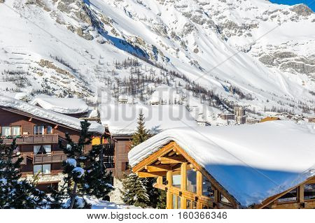 Alpine winter mountain landscape. French Alps covered with snow in sunny day. Val-d'Isere, France