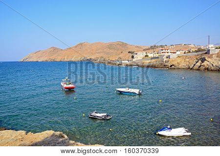 PANORMOS, CRETE - SEPTEMBER 15, 2016 - Small boats moored in the bay with views towards the rocky coastline Panormos Crete Greece Europe, September 15, 2016.