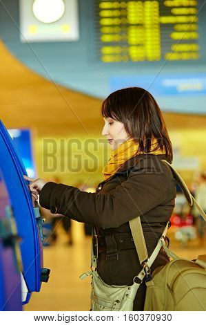 Girl Doing Self-checkin In The Airport