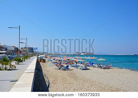 PERIVOLIA, CRETE - SEPTEMBER 15, 2016 - Tourists relaxing on the sandy beach Perivolia Crete Greece Europe, September 15, 2016.