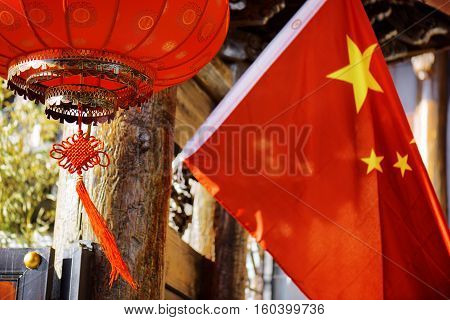 Traditional Chinese Red Lantern And The National Flag Of China