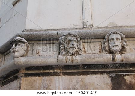 Sibenik cathedral /  Famous faces on the side protal of Sibenik cathedral.